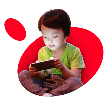 Child using mobile device on red background