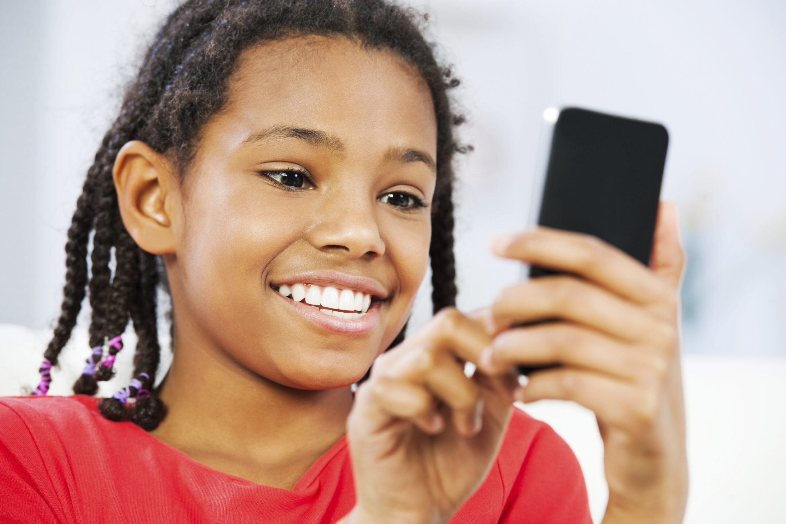 Young black pretty girl using a cellophane.